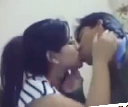 Kiss of indian school student in the room
